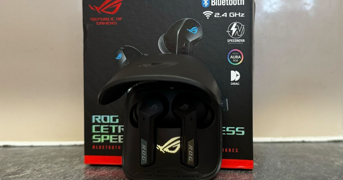 ASUS ROG Cetra earbuds inside the case in front of the box