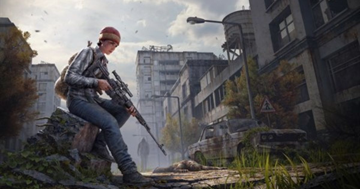 DayZ player holding gun with abandoned buildings in background