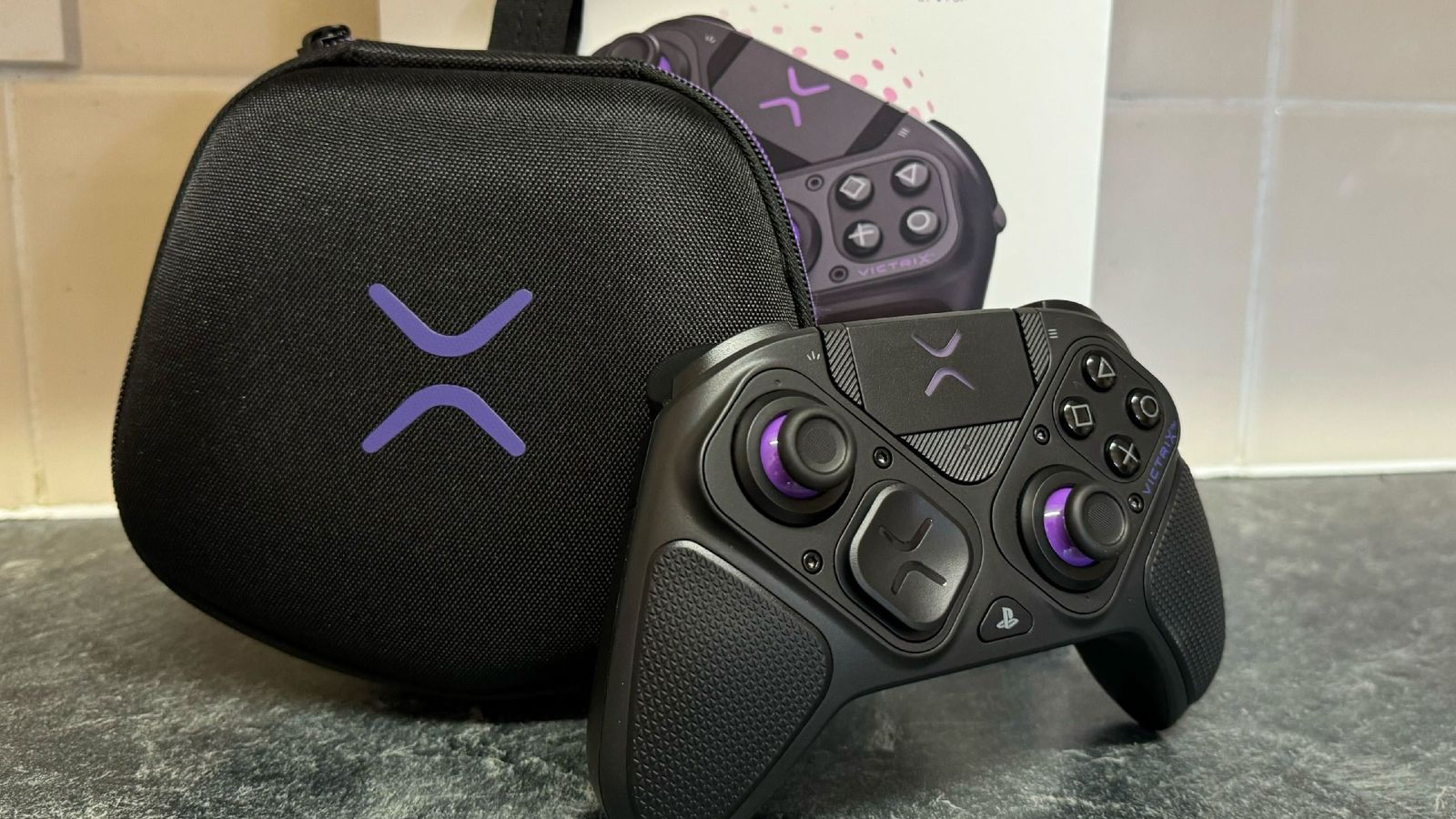 PDP Victrix Pro BFG for PS5 in front of a tiled wall