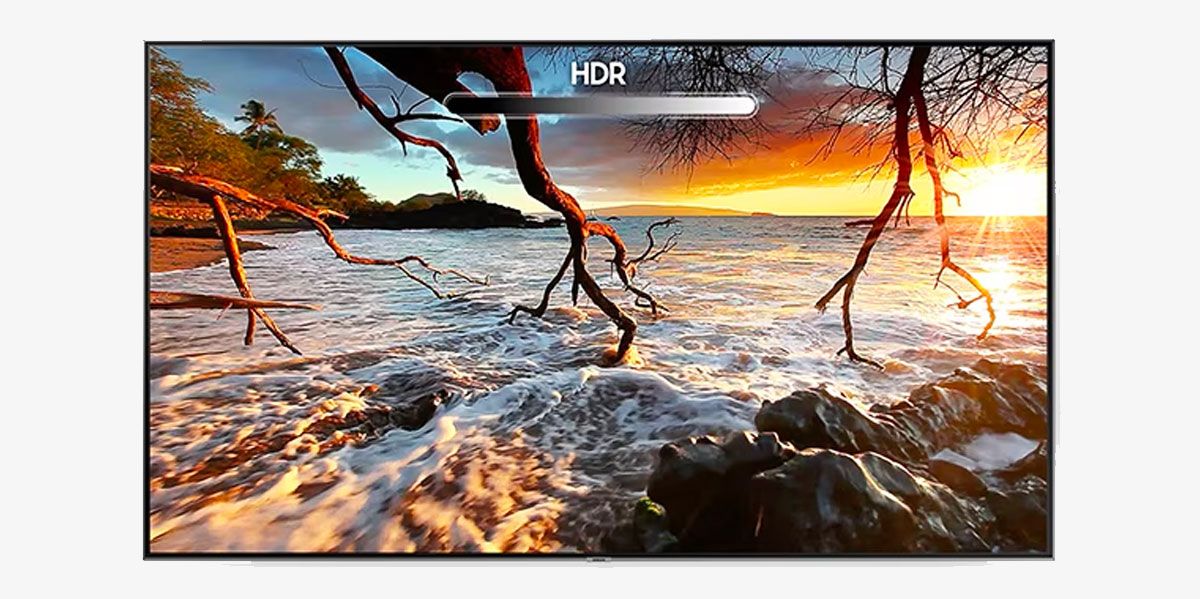 A TV marked with "HDR" is displaying the beach sunset image with High Dynamic Range.