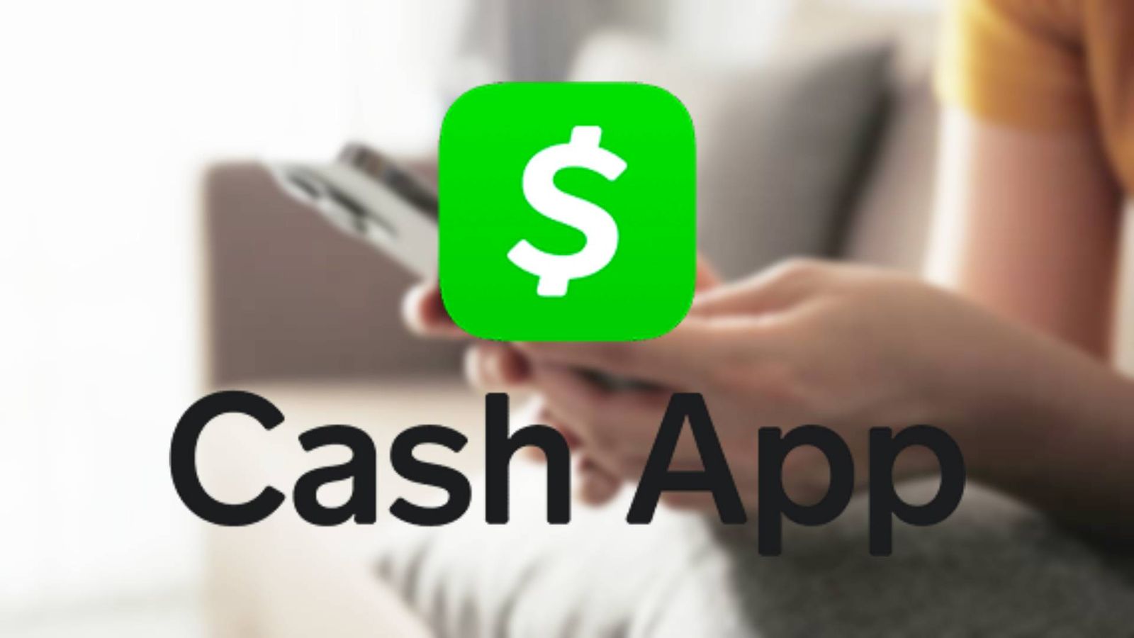How to deposit a check on Cash App - An image of the logo of Cash App with a person using smartphone in the background