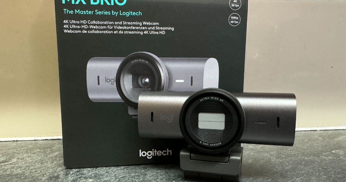 Logitech MX Brio standing next to the box it arrived in