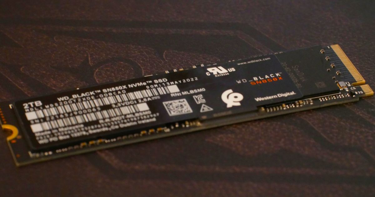 a close-up shot of a Western Digital WD Black SN850X SSD resting on top of an Elder Scrolls background 